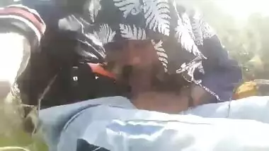 Bangladeshi Hijabi girl giving blowjob outdoors