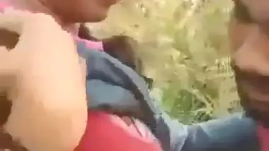 Indian outdoor sex of a guy sucking his GF’s tight boobs