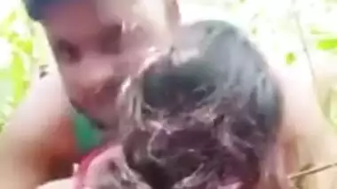 Young couple lovers enjoying sexy outdoor fun in the rice field